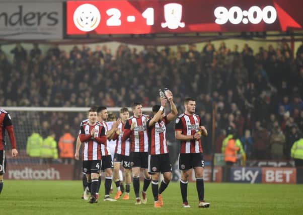 United players applaud supporters at Bramall Lane following the 2-1 win over play-off rivals Middlesbrough