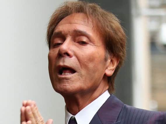 Sir Cliff arrives at court this morning