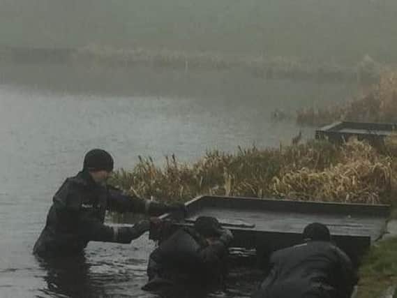 Officers during a search of the water