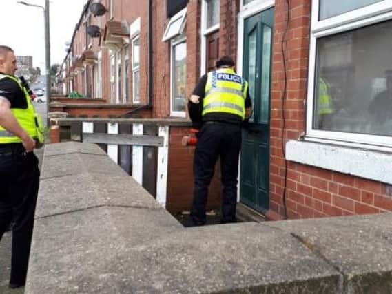 Officers at a house in Eastwood, Rotherham, as part of a crackdown on crime in the town today