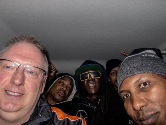 Kevin with Public Enemy in his Ford Focus.