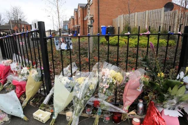 Flowers left at the place where Jarvin Blake was stabbed in Sheffield