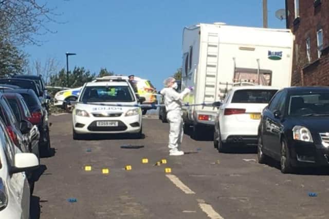 Forensic experts examine Sheffield street after shooting