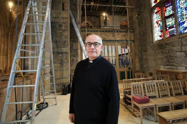 Rev Canon Keith Farrow inside Sheffield Cathedral, where lights and cameras had to be installed ready for the TV broadcast. Picture: Chris Etchells