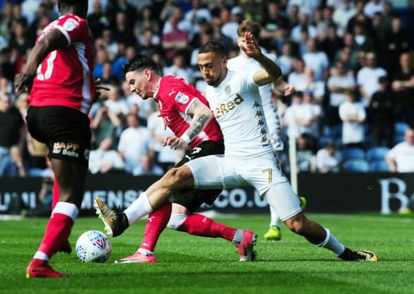 Leeds United v Barnsley..Kemar Roofe is challenged by Barnsley Adam Hammill.21st April 2018 ..Picture by Simon Hulme