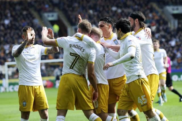 Sheffield Wednesday players congratulate Jordan Rhodes on his goal in the 1-0 win over Hull City on Saturday