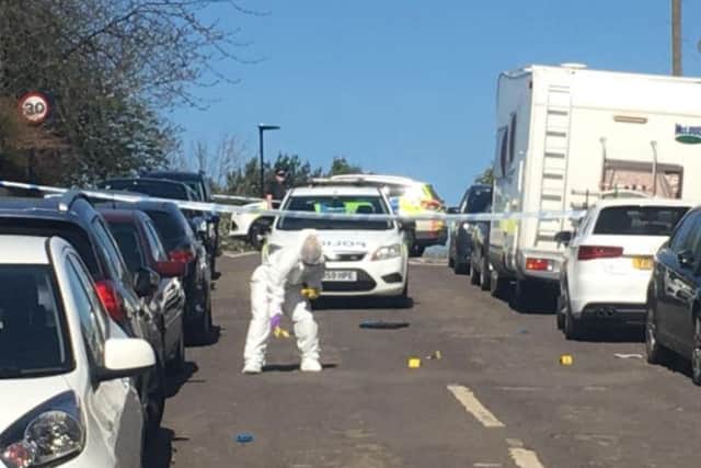 Forensic experts on Bransby Street after a shooting