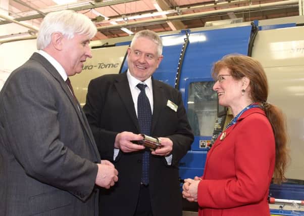 Carolyn Griffiths, president of the Institution of Mechanical Engineers with Stephen Shaw, right,  and Chris Rea of AESSEAL.