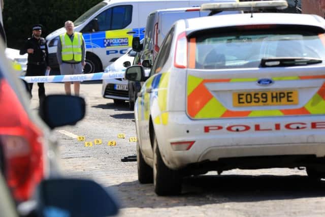 Police at the scene of the suspected shooting on Bransby Street, in Upperthorpe, Sheffield