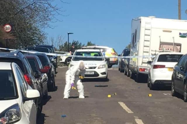 Forensic experts in Bransby Street, Upperthorpe, after a gun was fired at houses