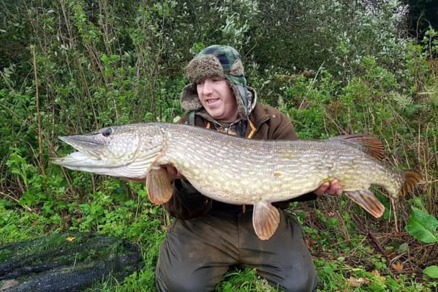 Jamie Redfern with a 20lb pike he caught in South Yorkshire last year