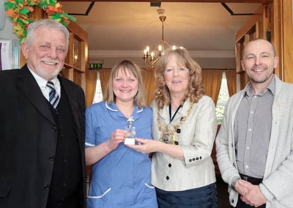 Staff member Helen is given her award at Rosebank Care Home, Sheffield, United Kingdom, 26th March 2018. Photo by Glenn Ashley.