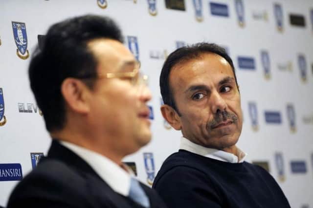 Jos Luhukay looks on while Dejphon Chansiri speaks during the manager's unveiling in January