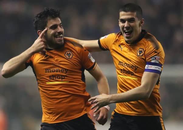 Wolverhampton Wanderers' Ruben Neves celebrates scoring  with Conor Coady