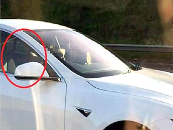 Bhavesh Patel, 39, appeared to have his hands behind his head when he was filmed by a passenger in another car. PA