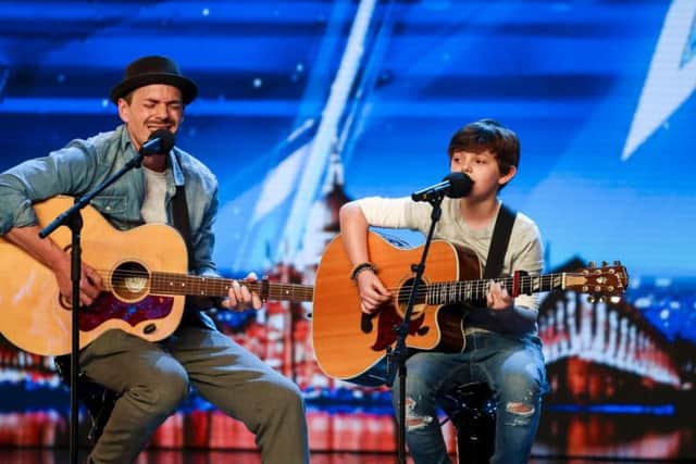 Father-and-son duo Tim and Jack received the golden buzzer from judge Simon Cowell (Picture:Tom Dymond/SYCO/Thames)
