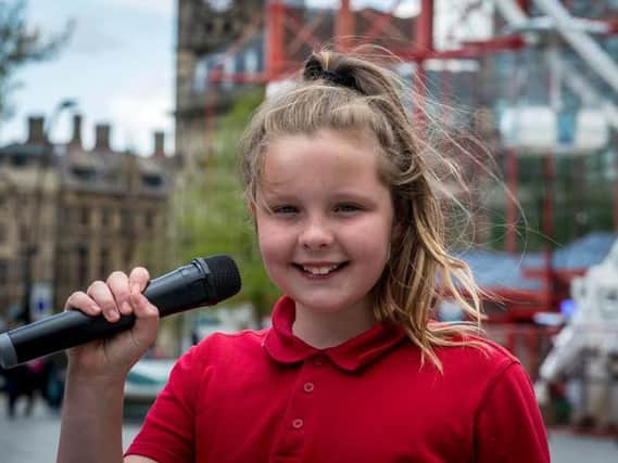 Connie Emery, aged 10, busks on The Moor in Sheffield and has now been approached to go on television