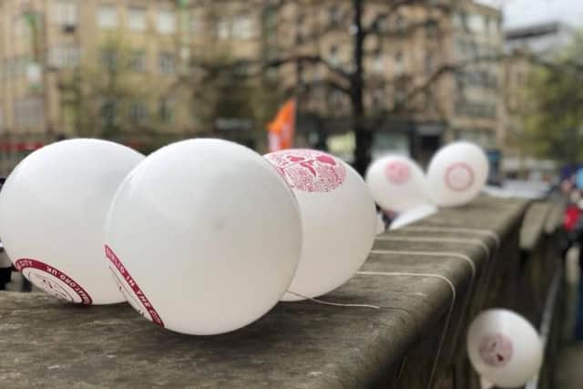 Volunteers from An Nisaha handed out balloons to promote their message that Islam says no to racism