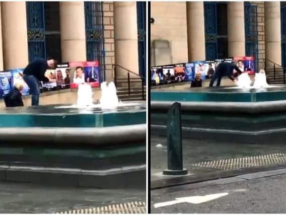 Moment man jumps into fountains - Credit: @millieclamp_