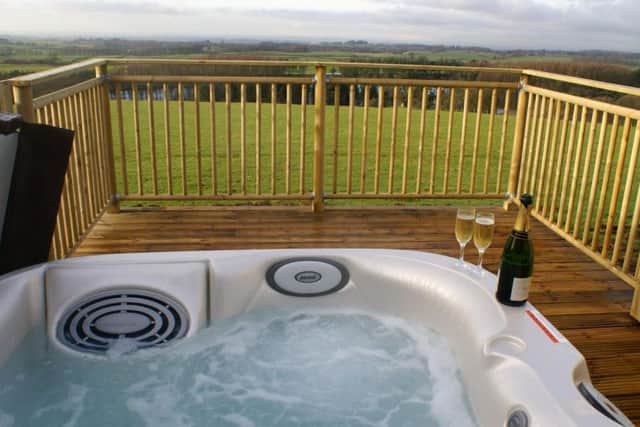 Each cottage has an outdoor hot tub