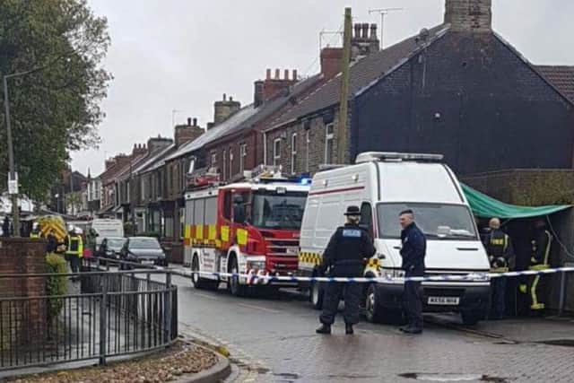 Police officers in Park Road, Mexborough, yesterday