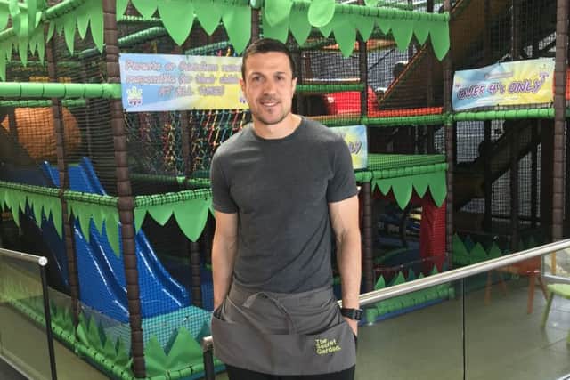 Richard Wood complete with pinny at the Secret Garden
