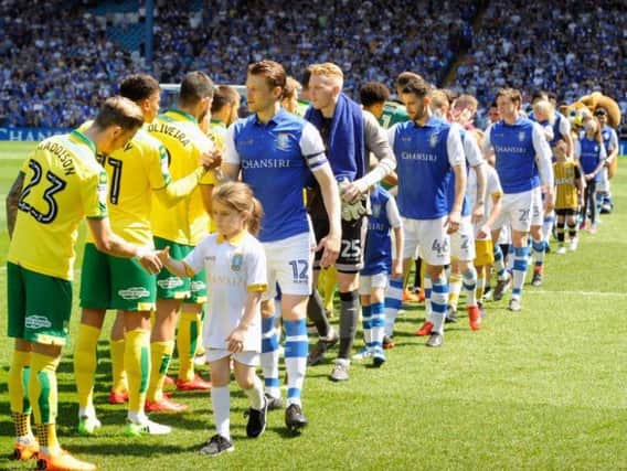 Glenn Loovens leads out Sheffield Wednesday for the final time in their match against Norwich City. Pic: Steve Ellis