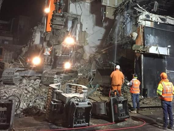 Crews on the site on Friday night. Picture: Richard Eyre.