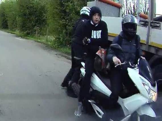 Police officers have issued a photograph of three males on a bike wanted over a spate of thefts