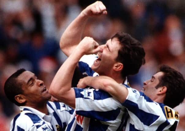 David Hirst is hoisted in the air by Mark Bright and John Harkes after equalising for Wednesday in the FA Cup final