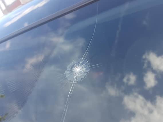 Damage to the windscreen, believed to have been caused by a pellet gun