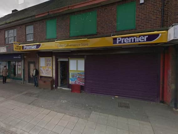 Two robbers brandishing machetes raided a shop in Sheffield