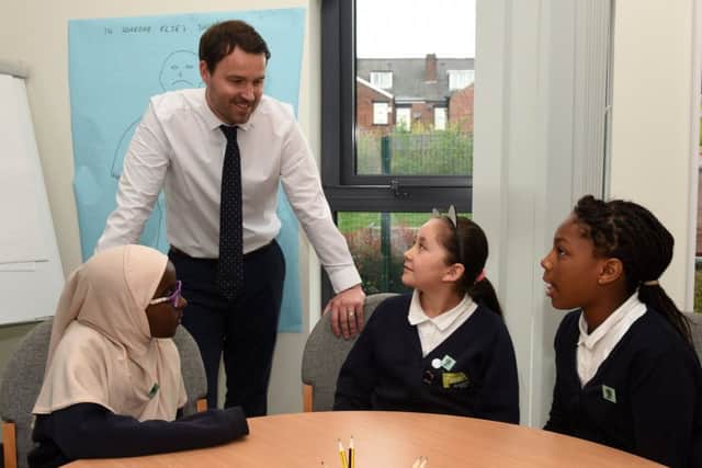 Kevin Cooper talks to (l-r) Fadumo, Sofia an Grace about bullying at Oasis Academy Fir Vale.