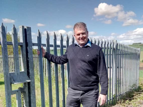 Open and shut: Yorkshire Land's Steven Green at gates onto railway property he claims Network Rail agreed to weld up.