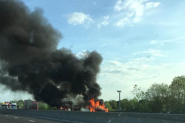 The fire sent smoke billowing across the carriageway. Picture: Andy Duffin.