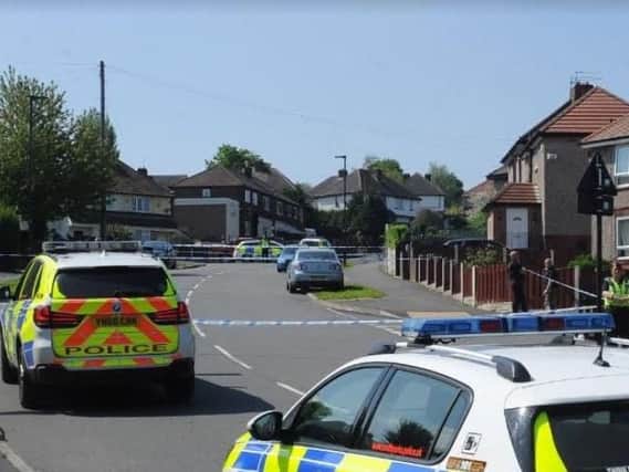 Police officers flooded a Sheffield estate after a shooting