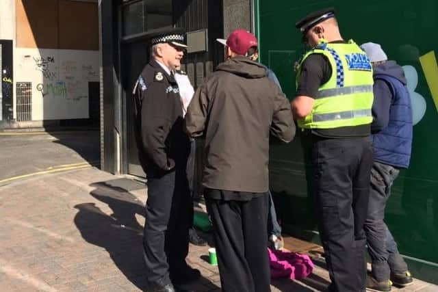 Police officers in Sheffield city centre dealing with begging and rough-sleepers