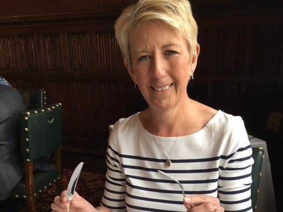 Angela Smith MP with the new Sheffield-made stainless steel cutlery introduced in the House of Commons