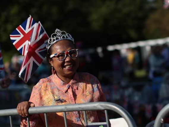 Spectators arrive on the Long Walk ahead of the wedding of Prince Harry and Meghan Markle. Picture: Hannah McKay/PA Wire