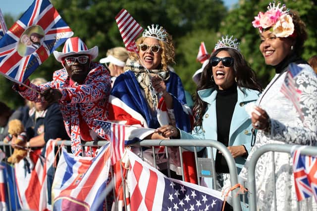 Spectators arrive on the Long Walk ahead of the wedding of Prince Harry and Meghan Markle. Picture: Aaron Chown/PA Wire