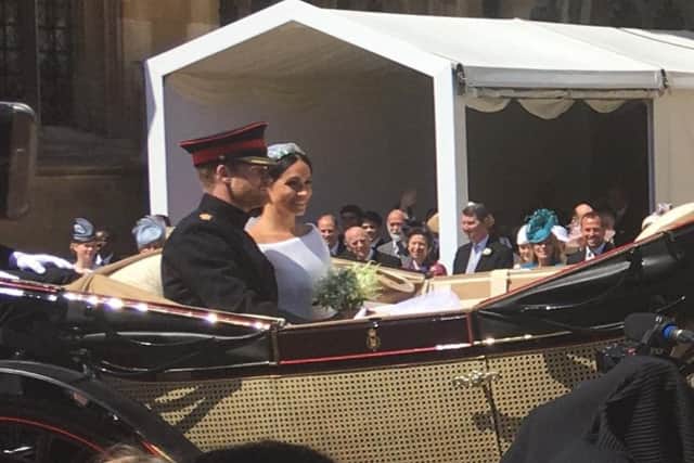 Harry and Meghan leave the church.