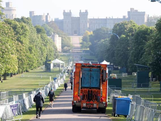 A bin lorry makes its way down the Long Walk in Windsor, as the clean-up continues after the royal wedding. Picture: Andrew Matthews/PA Wire