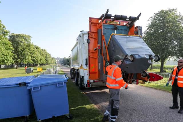 A bin lorry makes its way down the Long Walk in Windsor, as the clean-up continues after the royal wedding. Picture: Andrew Matthews/PA Wire