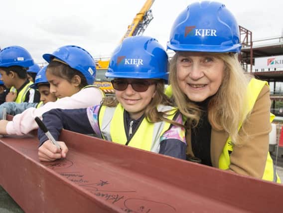 Sarah Jane Sykes signs her name on the last steel with Coun Jackie Drayton