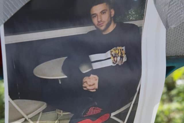A photograph, believed to be of the victim, has been left at the crash scene