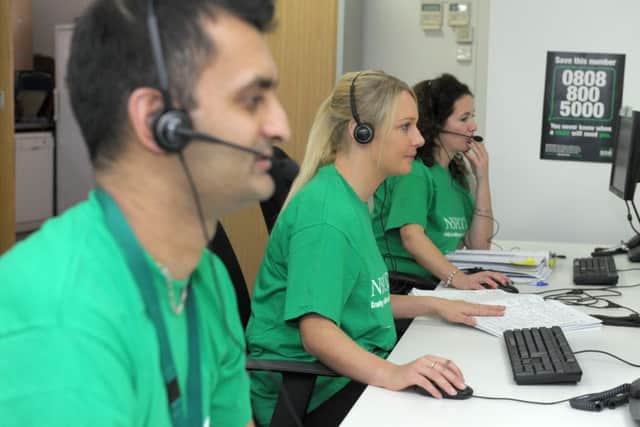 *** Job ordered by Emma Harvey at the NSPCC ***
Pictured is Lucy Hudson (Brown Hair), Louise Bennett (Blonde Hair), Arif Aslam from the helpline staff on the phones at the call centre in Salford Quays, MANCHESTER. *** Local Caption *** Disclaimer: While Cavendish Press (Manchester) Ltd uses its' best endeavours to establish the copyright and authenticity of all pictures supplied, it accepts no liability for any damage, loss or legal action caused by the use of images supplied.  The publication of images is solely at your discretion.