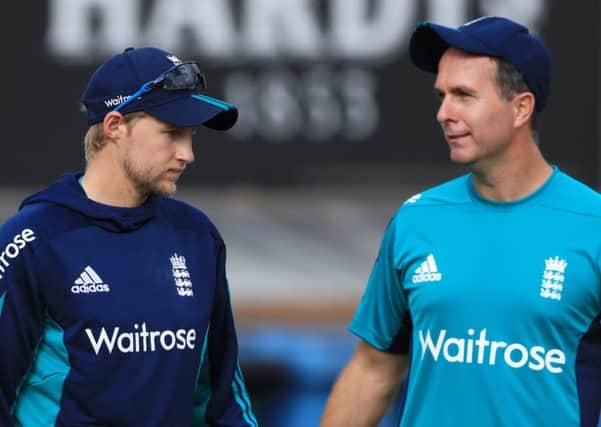England's Joe Root chats with former England captain Michael Vaughan