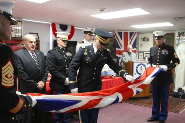 The Union Jack from the second HMS Sheffield is returned to the Royal Navy during a ceremony in Newark, US, in September 2017 (pic: Josh Shannon/Newark Post)