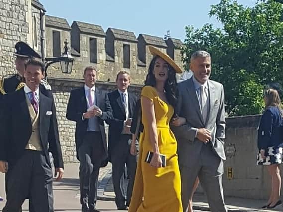 Amal and George Clooney at the royal wedding, as snapped by Jarnel and Narmila Singh