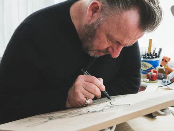 Pete McKee at work. Picture: India Hobson